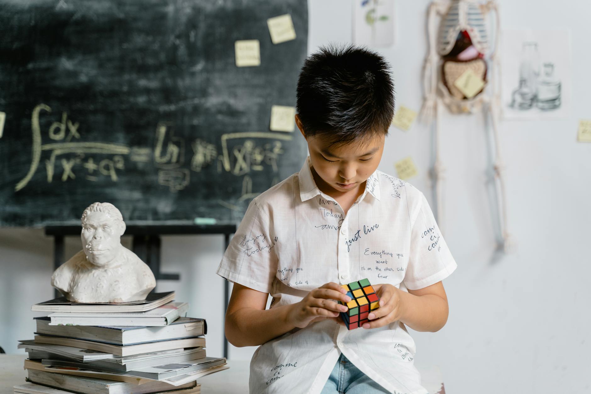 A child focuses on solving a Rubik's cube in an academic setting, reflecting intelligence and concentration.
